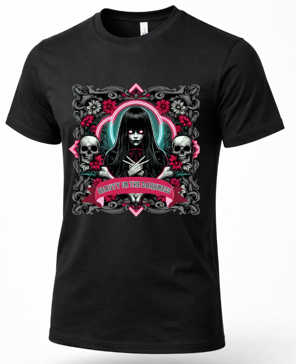 A black short-sleeve crewneck t-shirt featuring a gothic-style graphic print of a dark-haired woman with a glowing pink and teal halo, flanked by skulls and roses, with a banner reading 'BEAUTY IN THE DARKNESS'.