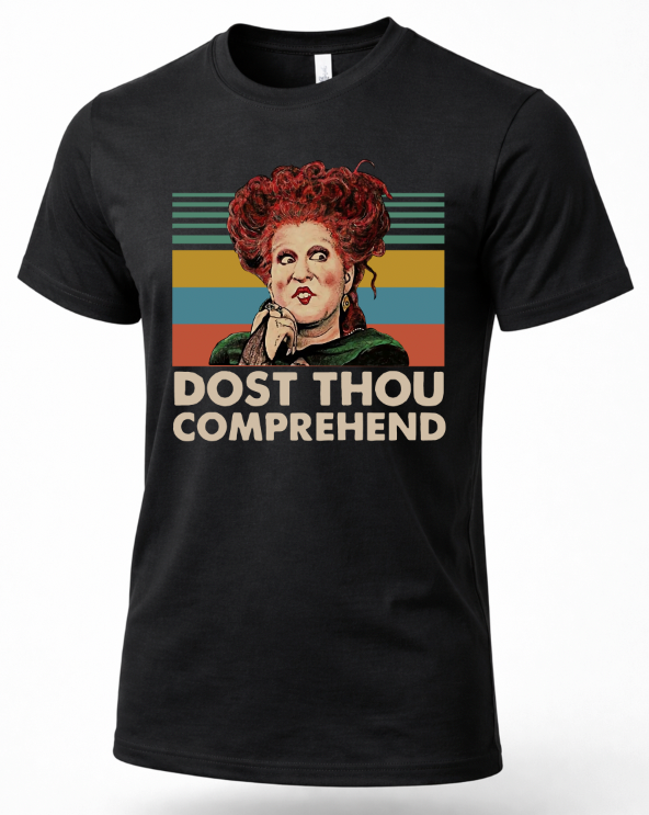 A black short-sleeve crewneck t-shirt featuring a retro-style graphic of the character from Hocus Pocus with red hair and the text 'DOST THOU COMPREHEND' in beige, shown against a plain white background.