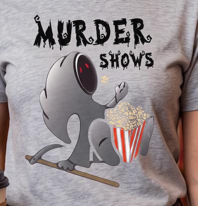 A close-up of a person wearing a heather gray t-shirt with a graphic print. The print features the text 'MURDER SHOWS' in a dripping black font above a cartoon gray creature holding a striped popcorn bucket.