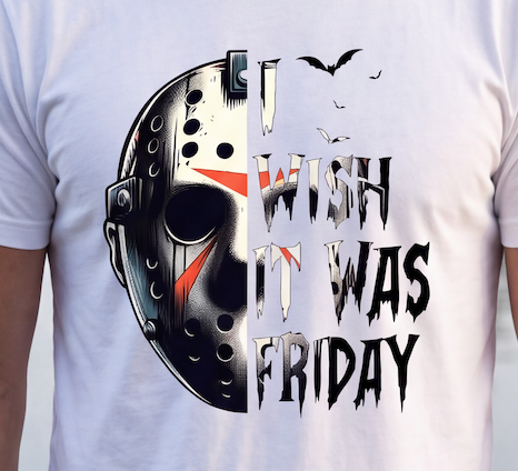 A close-up of a person wearing a white graphic T-shirt. The shirt features a split design: the left half shows a black and white hockey mask with red accents, and the right half reads 'I WISH IT WAS FRIDAY' in distressed black and white lettering with small bat silhouettes above.