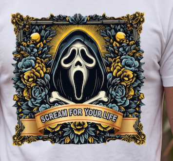 A close-up of a white T-shirt featuring a large graphic print. The design shows the Ghostface mask centered within a black hood, surrounded by blue and yellow roses, with a banner reading 'SCREAM FOR YOUR LIFE' below, on a white shirt.