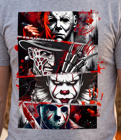 A person wearing a heather gray t-shirt with a large, detailed horror graphic print featuring Michael Myers, Freddy Krueger, Pennywise, and Jason Voorhees in a red, black, and white color scheme.