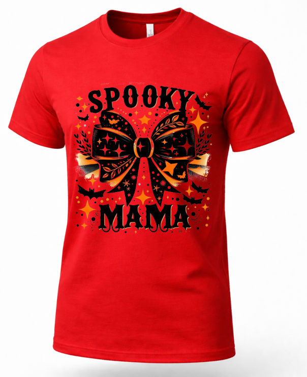 A red short-sleeve crewneck t-shirt featuring a 'Spooky Mama' Halloween graphic with a large black bow, bats, stars, and orange accents on a white background.