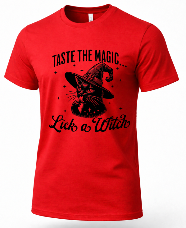 A red short-sleeve crewneck t-shirt featuring a black graphic of a witch cat wearing a pointed hat, with the text 'TASTE THE MAGIC.