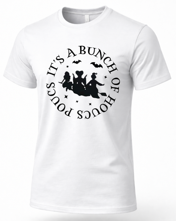 A white short-sleeve T-shirt with a black circular graphic and text reading 'IT'S A BUNCH OF PLOUS' around a witch riding a broomstick with bats.
