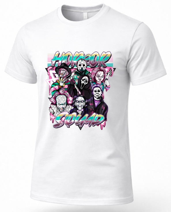 A white short-sleeve crewneck t-shirt featuring a colorful graphic print of horror movie villains with the text 'HORROR VILLAIN SQUAD' in stylized pink and blue lettering.