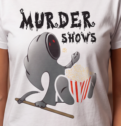 A white short-sleeve t-shirt featuring a graphic print of a gray cartoon character holding a red-and-white popcorn bucket under the text 'MURDER SHOWS' in a dripping horror font.