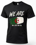 A black short-sleeve crewneck t-shirt featuring a distressed graphic of the Algeria flag with the text 'WE ARE' above and 'ALGERIA' below, displayed on a clean white background.