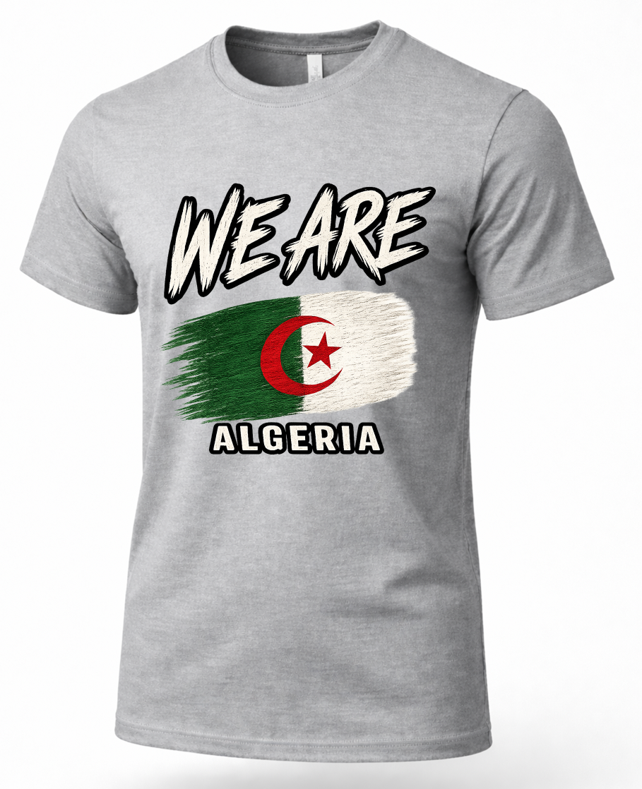 A heather gray short-sleeve t-shirt featuring a distressed graphic of the flag of Algeria with the text 'WE ARE' above and 'ALGERIA' below, displayed on a clean white background.