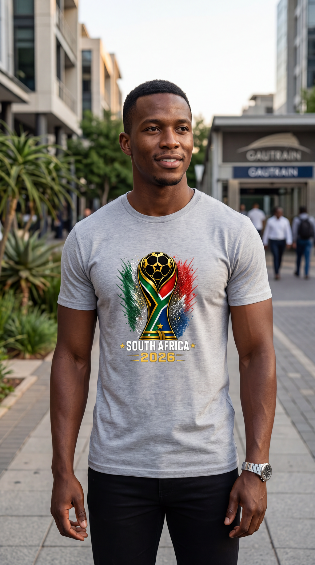 Man wearing a gray t-shirt with South Africa 2023 design in an urban setting