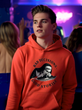Man wearing red hoodie with “Bad Decisions Good Stories” graphic in nightlife setting streetwear style