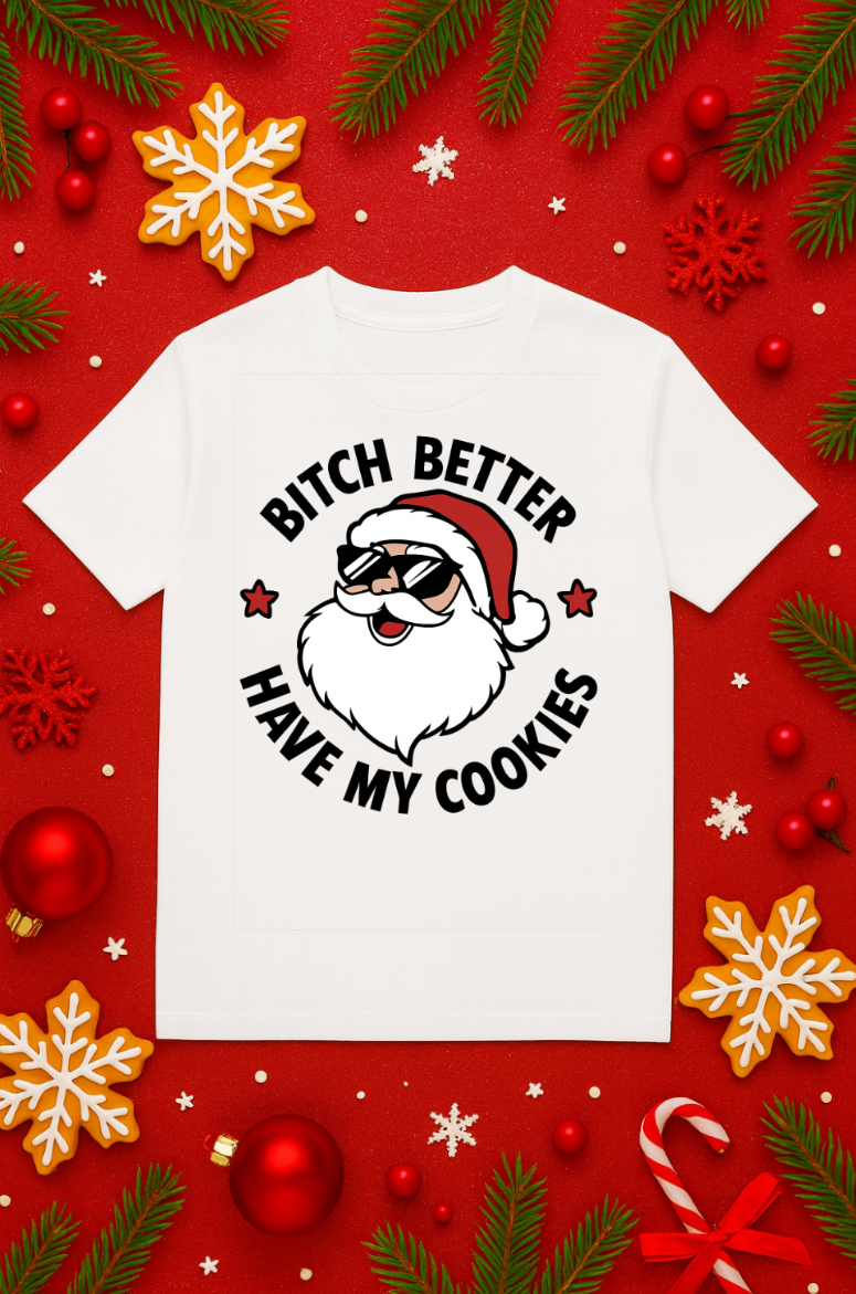 White Christmas t-shirt with a cartoon Santa wearing sunglasses and a humorous holiday cookie-themed quote, displayed on a festive red background with ornaments and snowflakes.