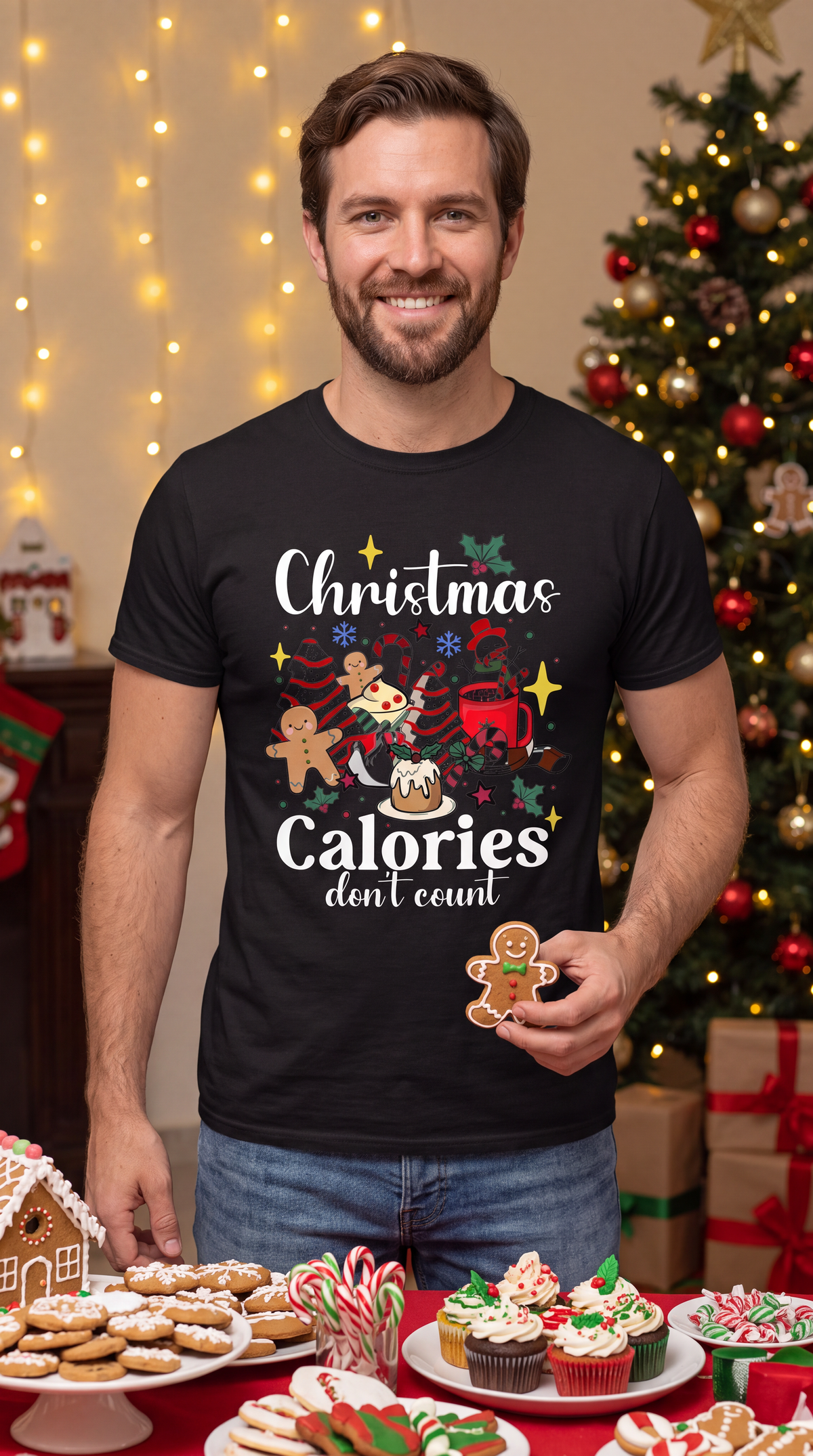 Man wearing black Christmas Calories Don’t Count shirt featuring festive cookies, cocoa and holiday food graphics.