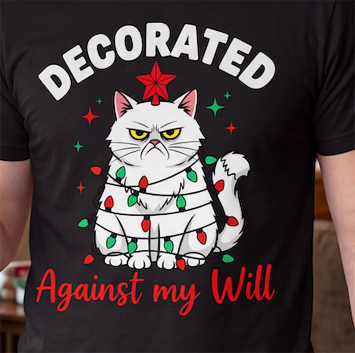 Close-up of funny grumpy cat Christmas graphic printed on black shirt.