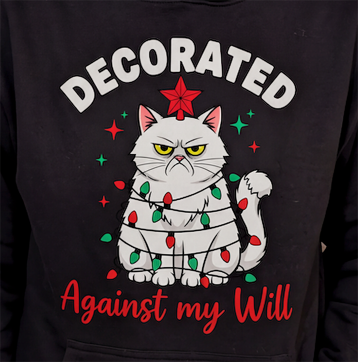 Close-up of black Decorated Against My Will Christmas cat hoodie graphic