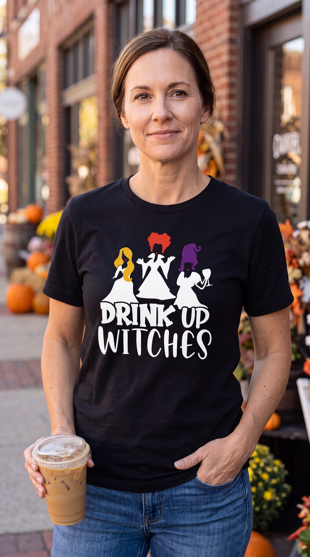 Woman wearing black Drink Up Witches Hocus Pocus Halloween graphic tee