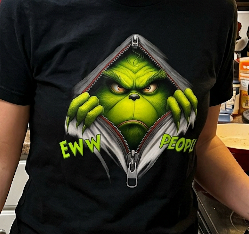 Black Close-Up: Close-up of the Eww People Grinch graphic on a black shirt showing the bright green face, zipper details, and sarcastic Christmas design.
