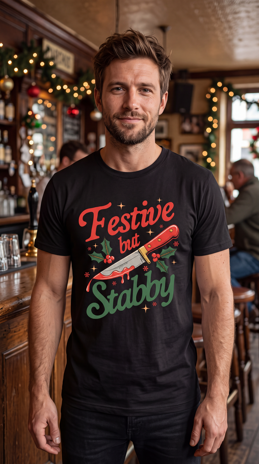 Man wearing black Festive But Stabby funny Christmas shirt with holiday knife graphic