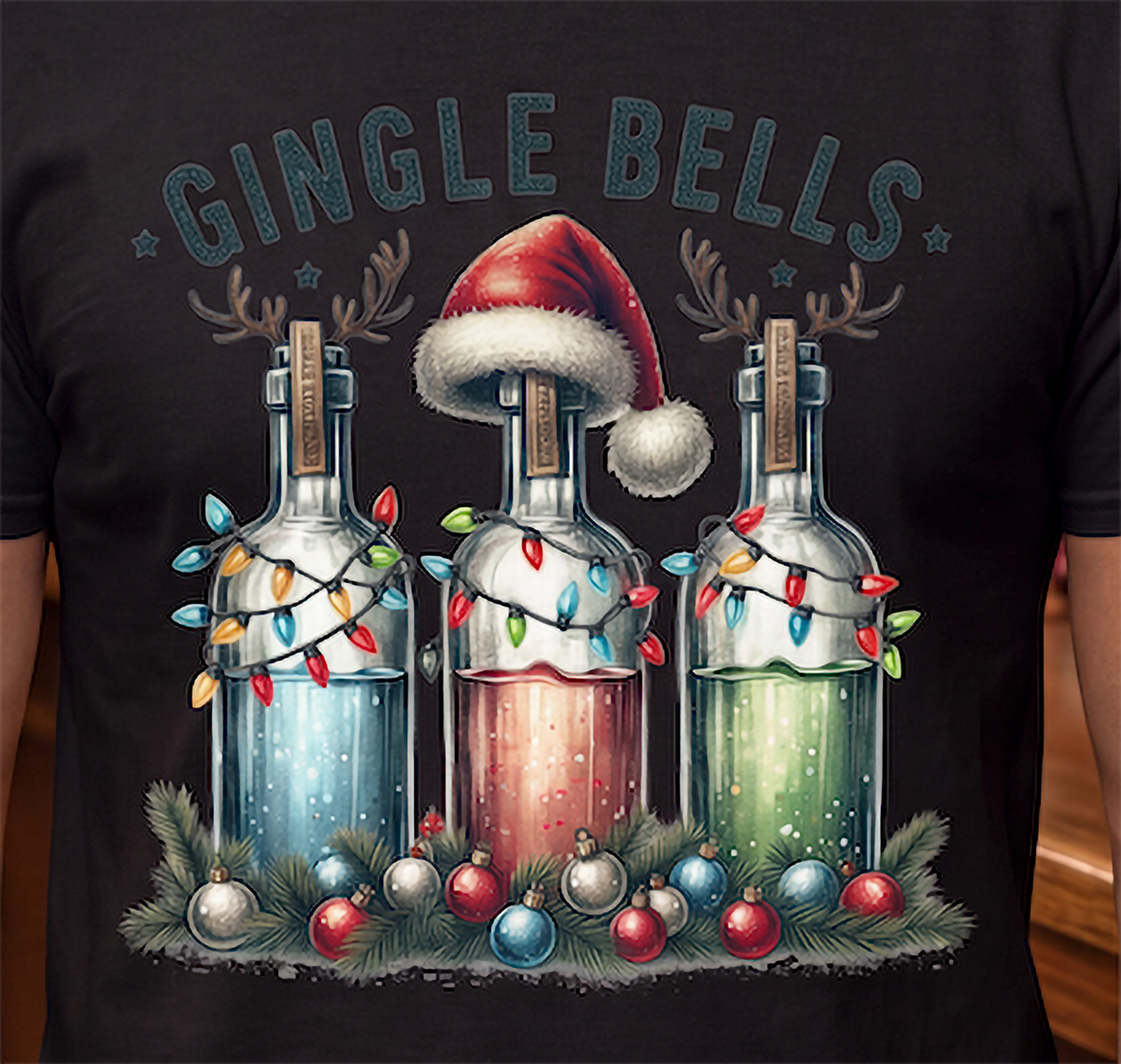 lose-up of Gingle Bells festive liquor bottle Christmas design on black shirt