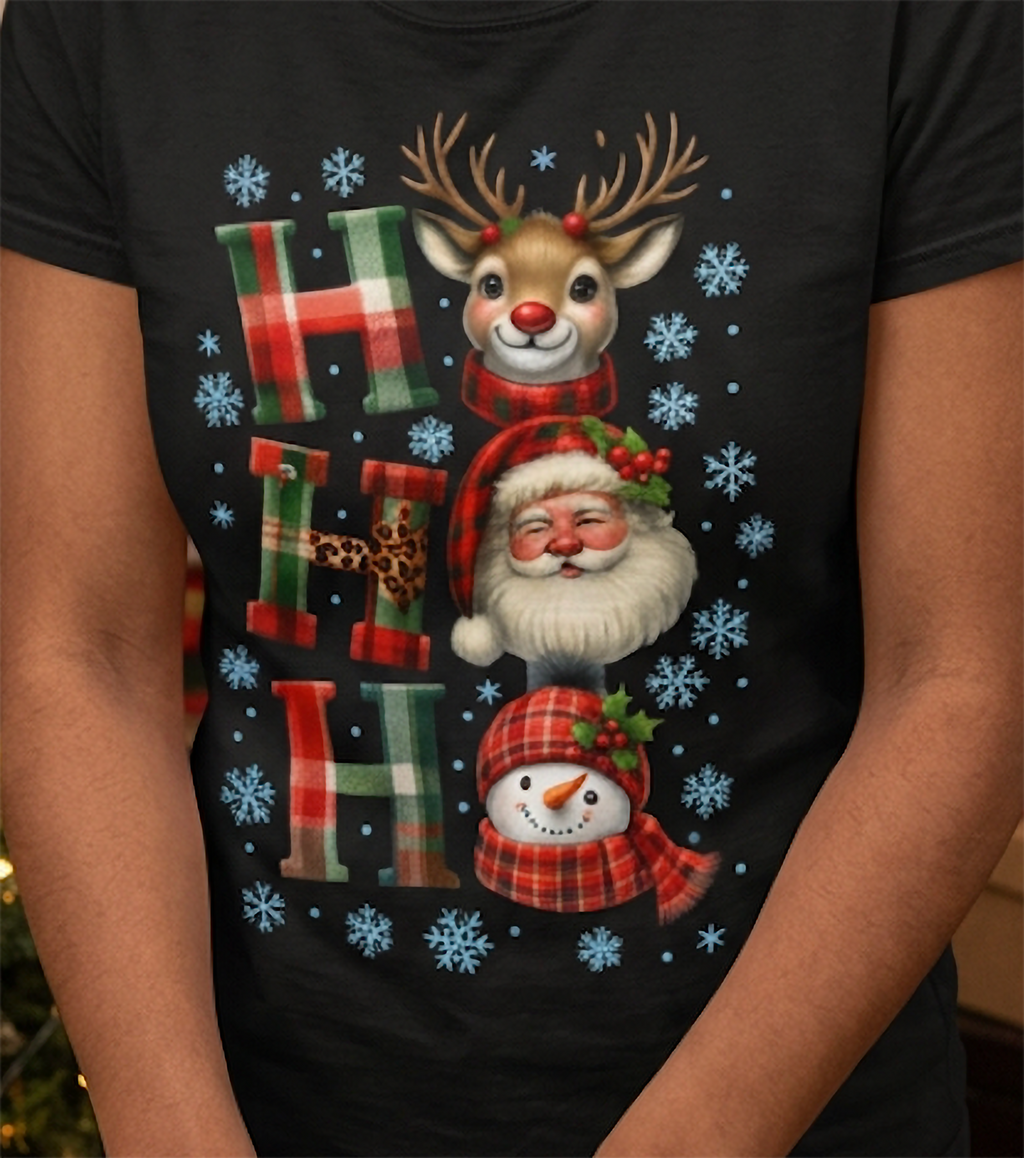 Close-up of black Christmas shirt showing colorful Ho Ho Ho design with reindeer, Santa, snowman and blue snowflakes.