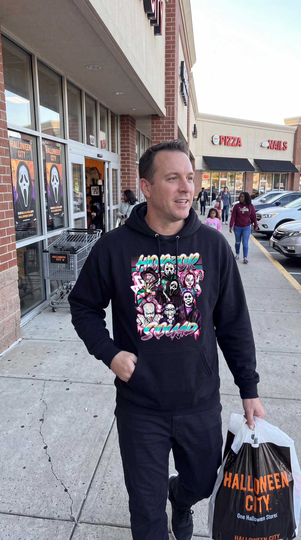 Woman wearing black Horror Squad hoodie for Halloween and spooky season