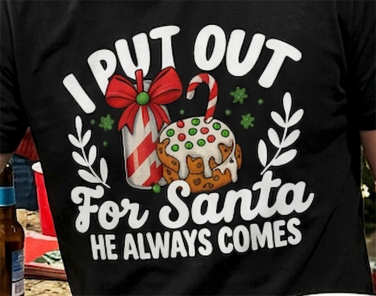 Close-up of I Put Out for Santa He Always Comes graphic on black Christmas t-shirt
