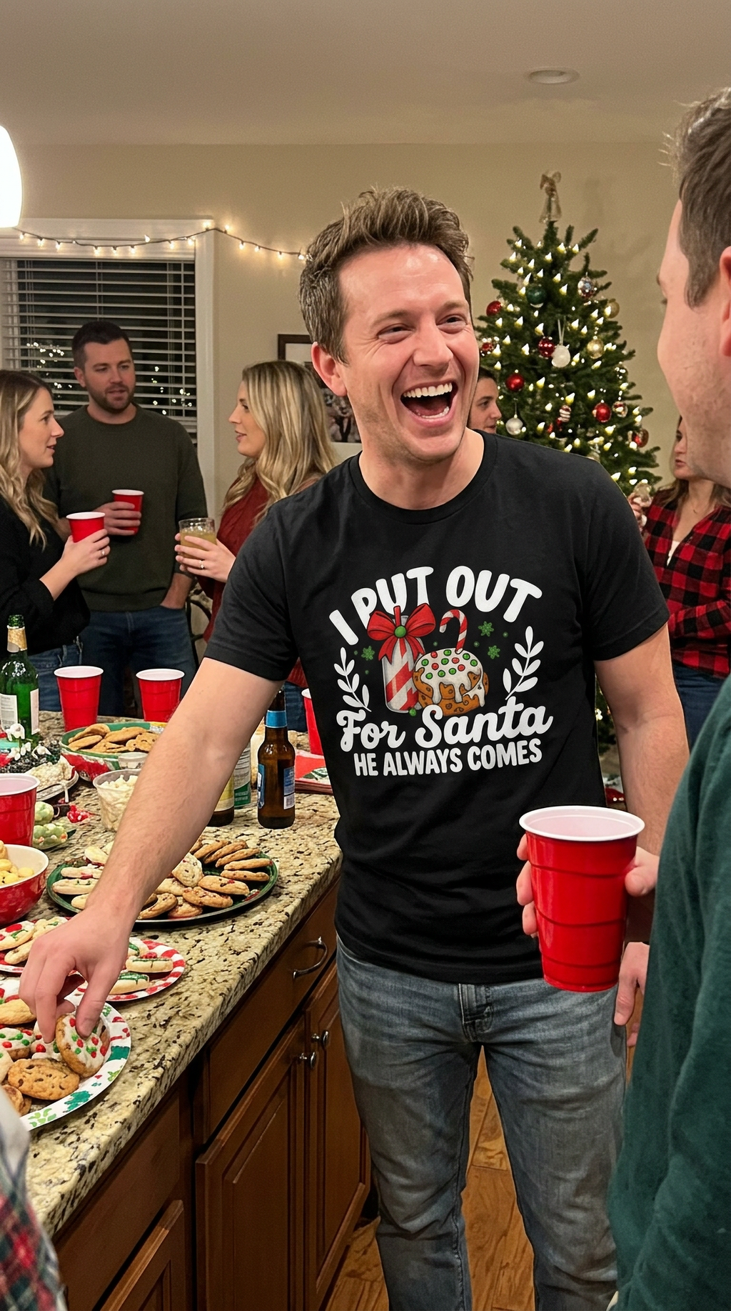 Man wearing black I Put Out for Santa Christmas shirt at a festive holiday gathering