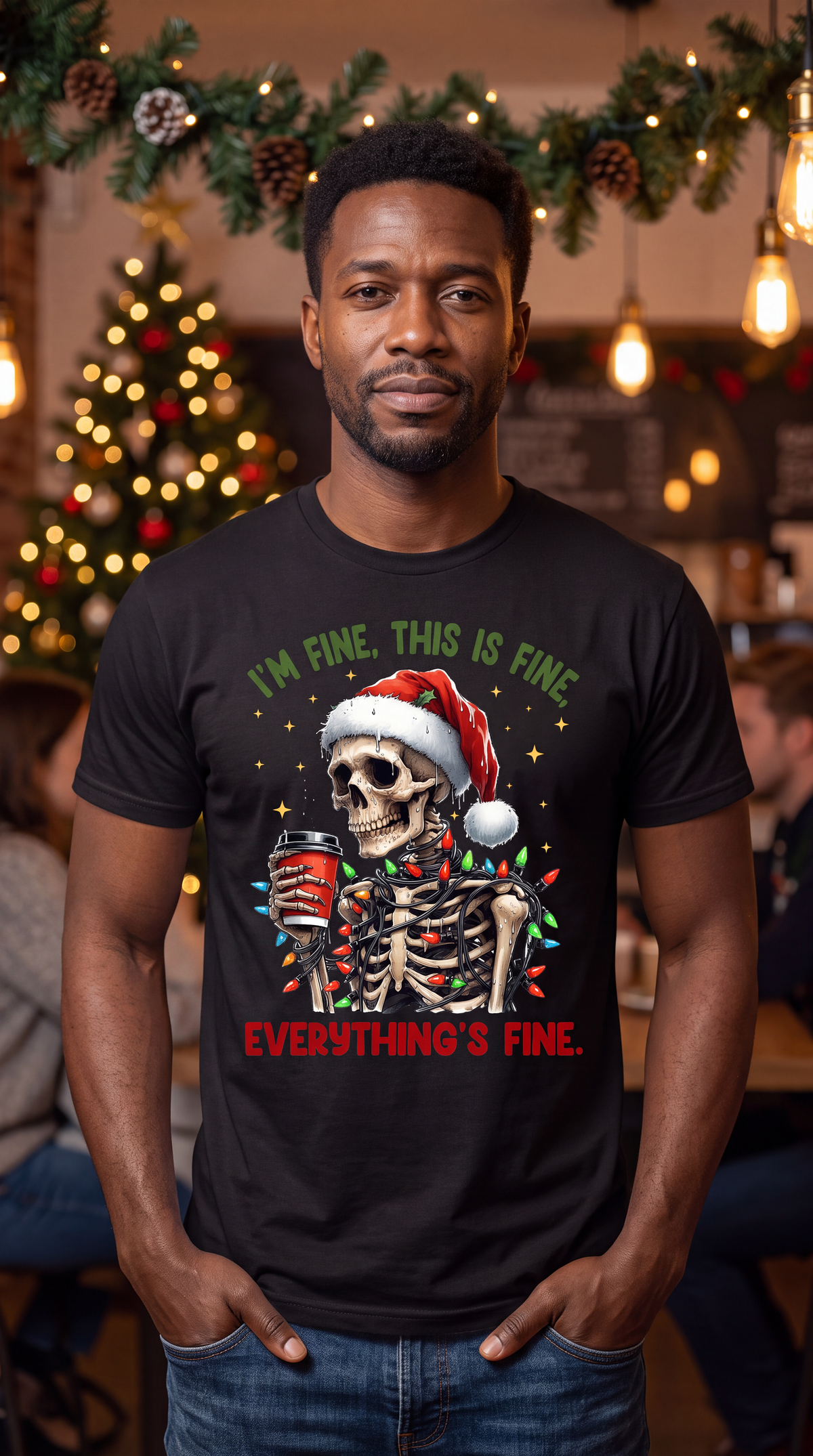 Man wearing black I’m Fine Everything’s Fine skeleton Christmas shirt in a festive holiday setting.