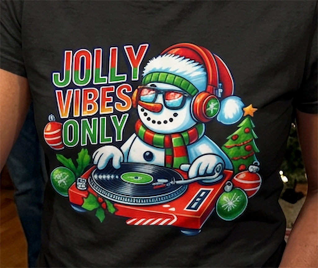 Black Close-Up: Close-up of Jolly Vibes Only Christmas shirt design featuring a snowman DJ spinning records with colorful holiday decorations.