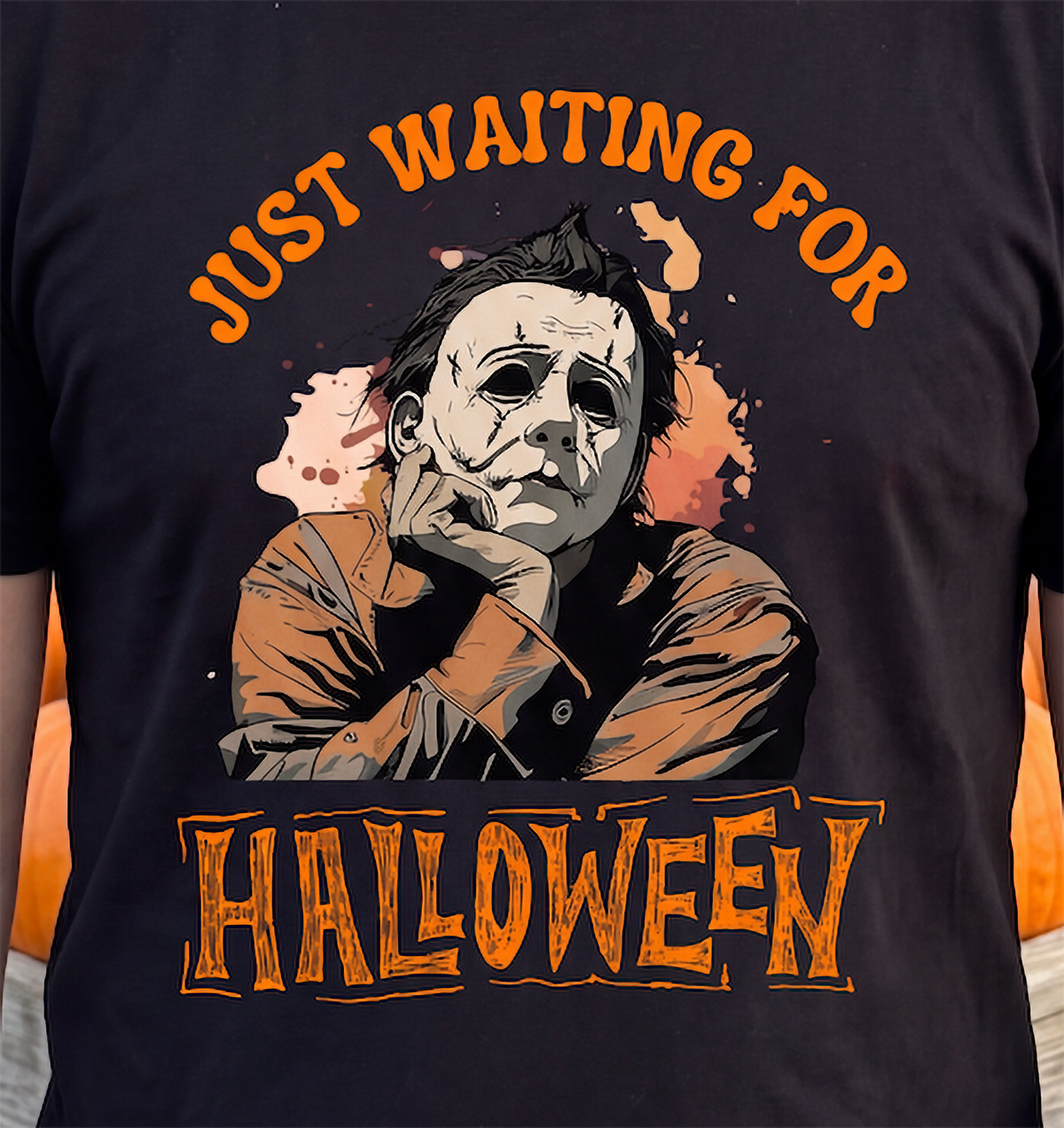 Close-up of black Michael Myers Halloween shirt with orange horror design