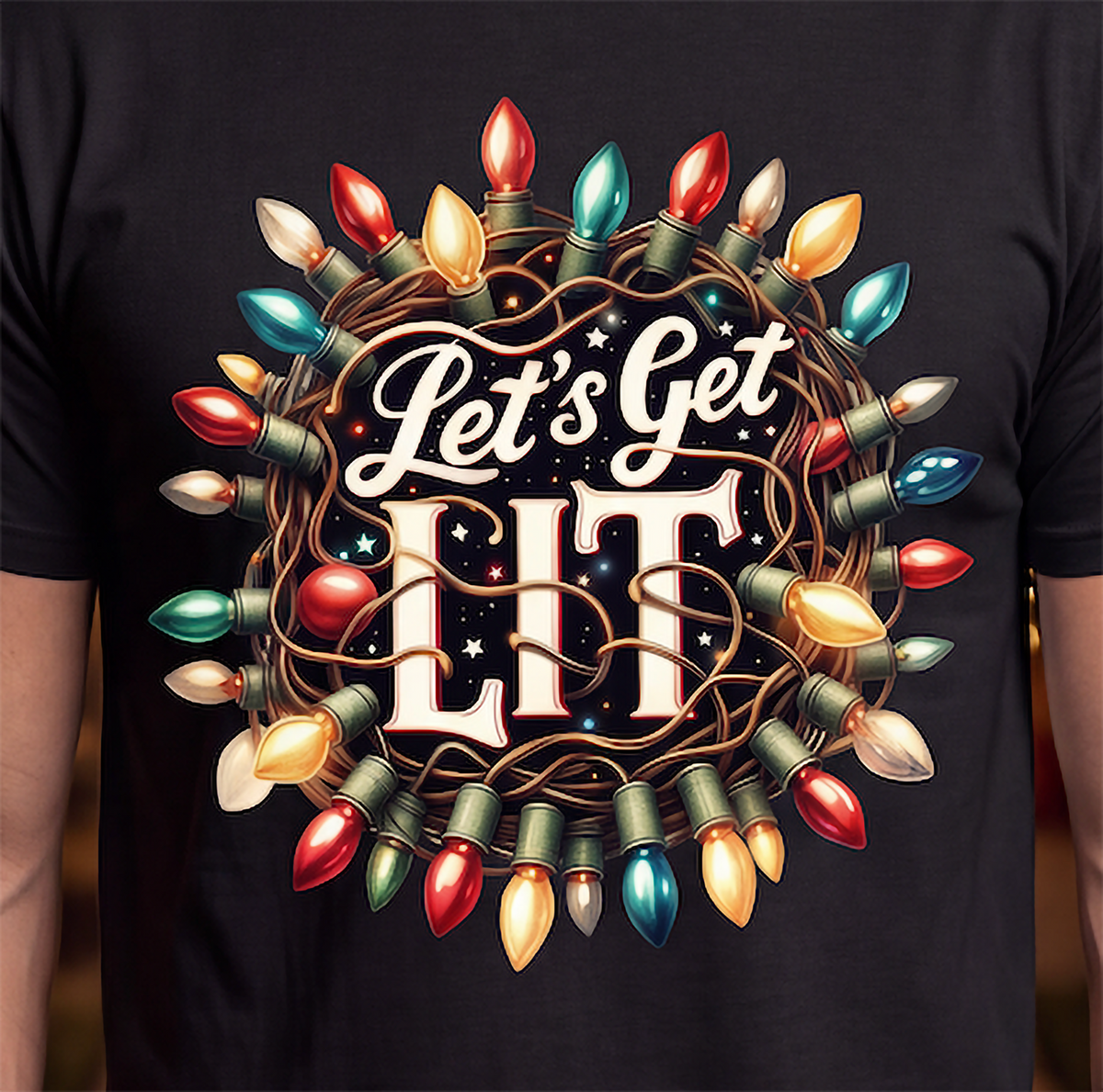 Close-up of Let’s Get Lit Christmas lights graphic printed on black shirt.