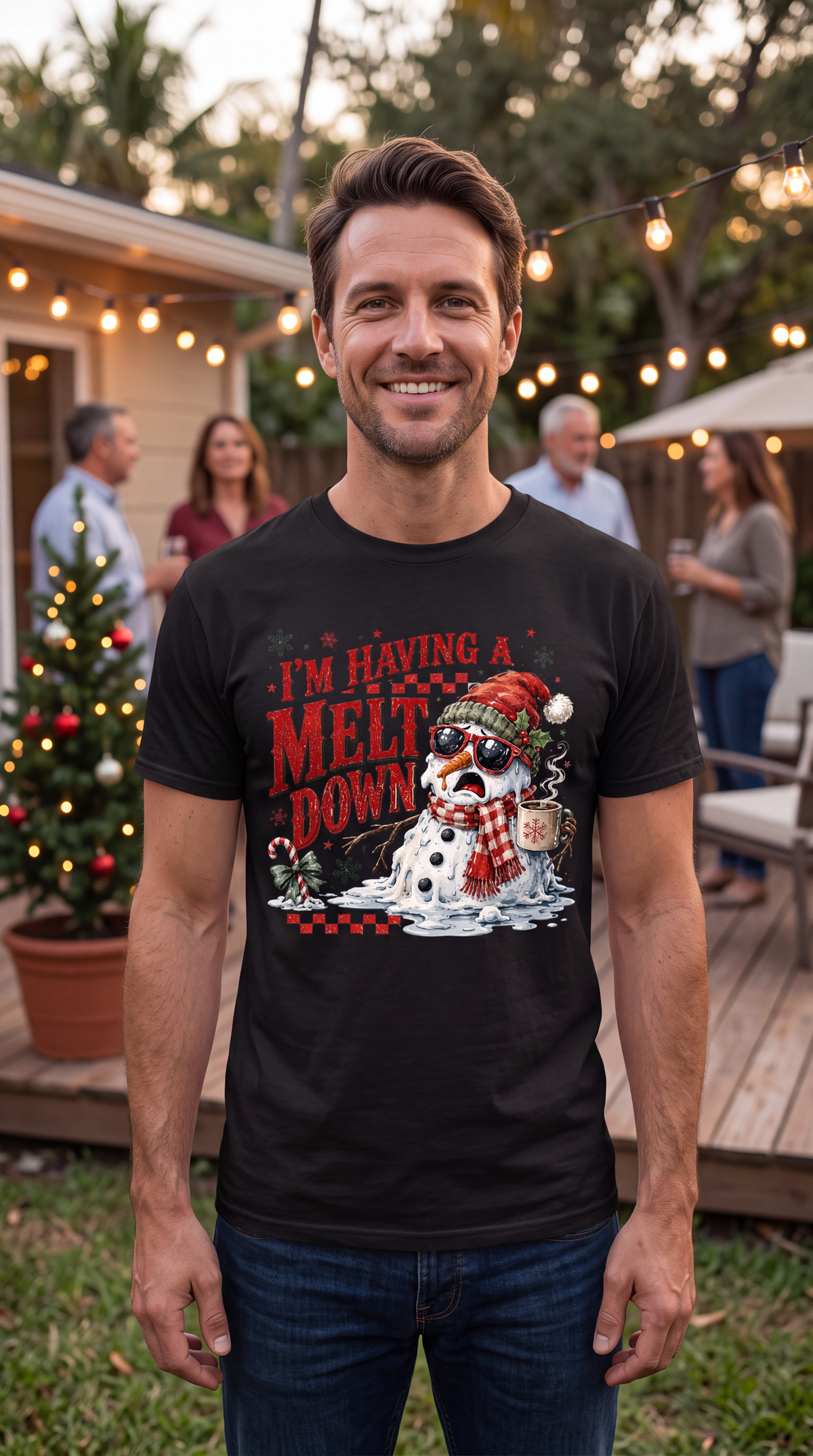 Man wearing black I’m Having a Meltdown Christmas graphic shirt outdoors in a festive holiday setting.