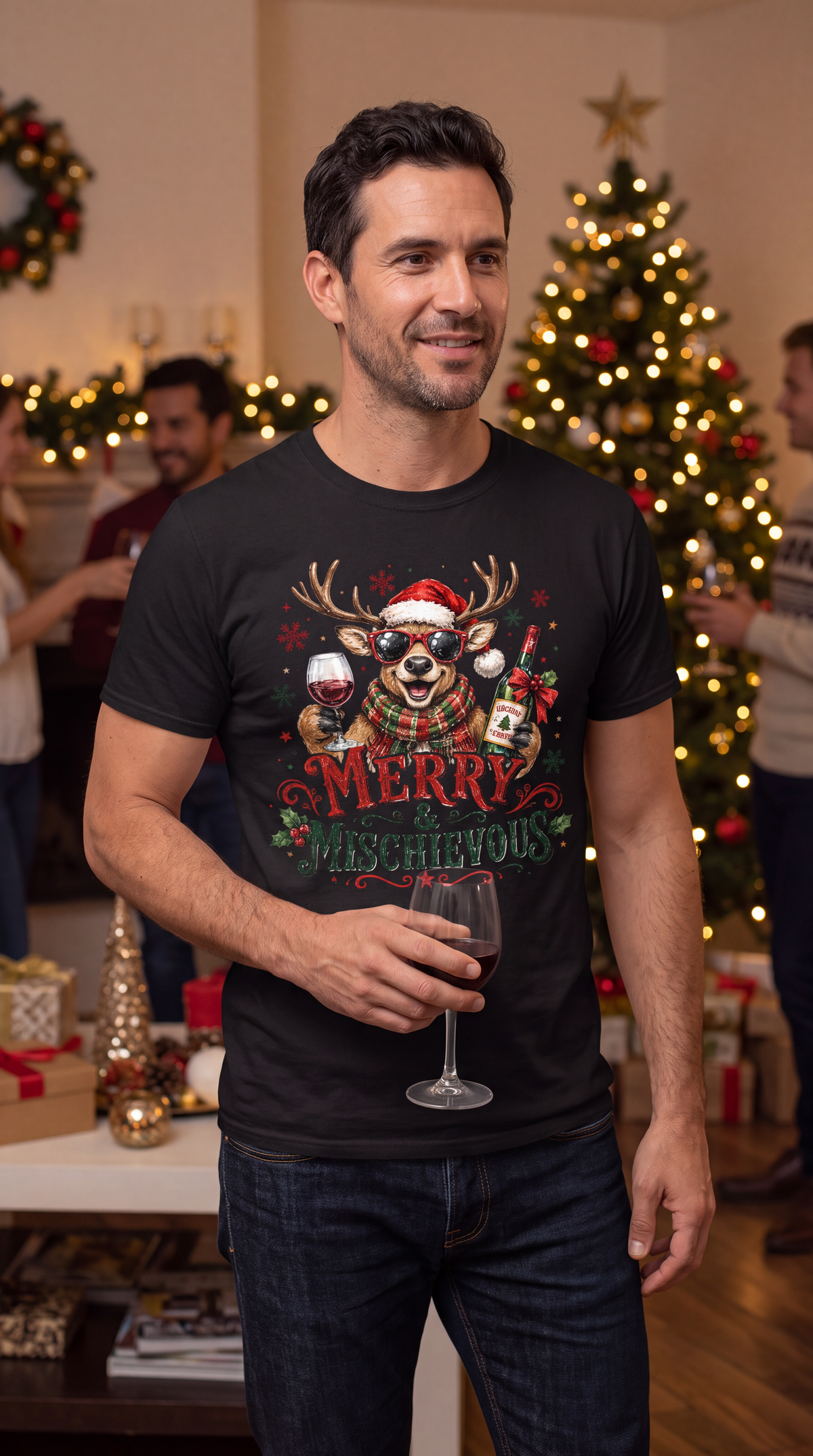 Man wearing black Merry & Mischievous Christmas shirt with festive reindeer and wine design at a holiday party.