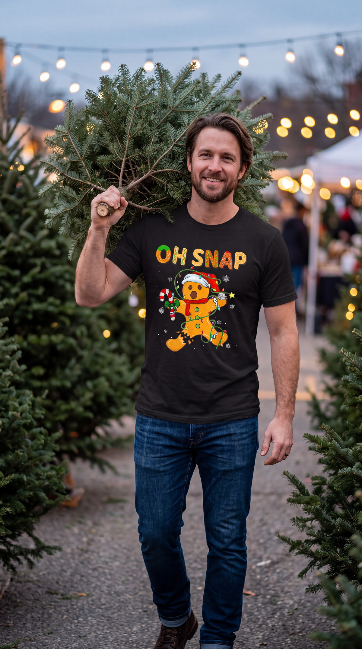 Person wearing black Oh Snap gingerbread Christmas graphic T-shirt outdoors.