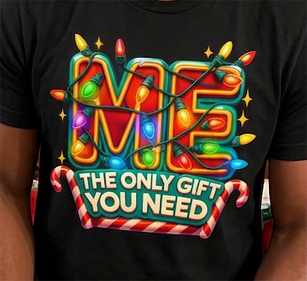 Black Design Close-Up: Close-up of colorful Christmas lights and bold Me The Only Gift You Need graphic printed on a black holiday t-shirt.
