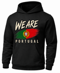 A black pullover hoodie with a distressed graphic on the front that reads 'WEARE PORTUGAL' above and below a stylized Portuguese flag design, shown on a plain white background.