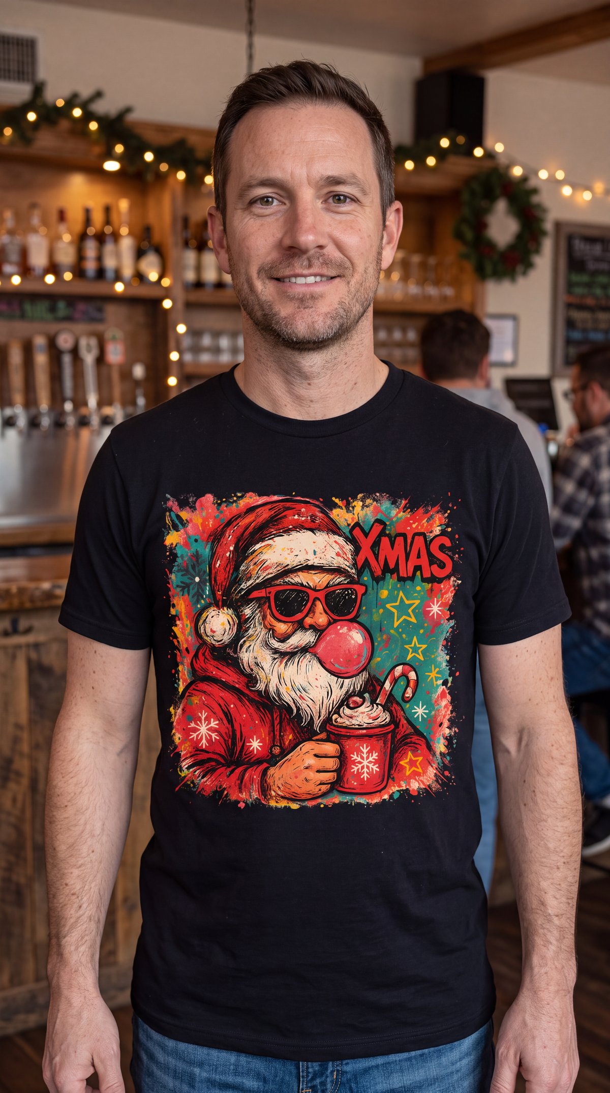 Man wearing black retro Bubblegum Santa Christmas shirt with sunglasses and colorful holiday graphic.