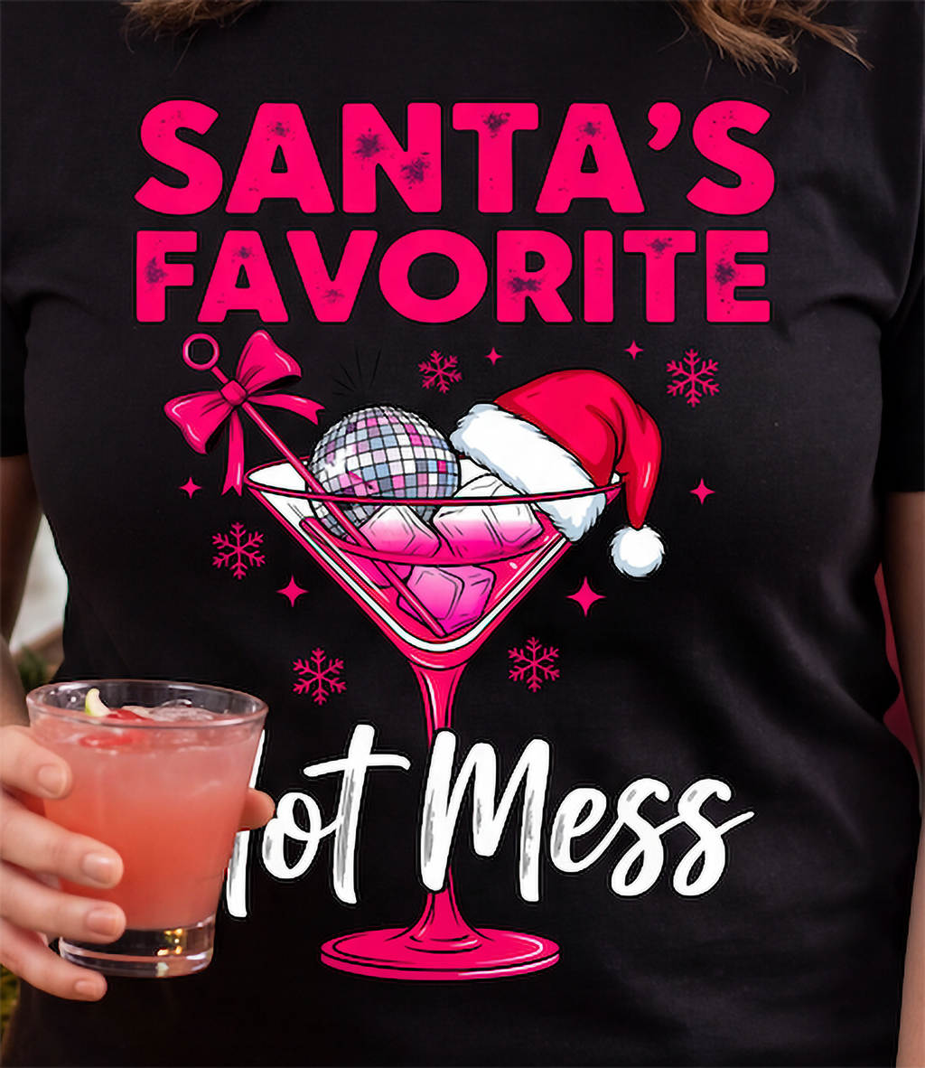 Close-up of Santa’s Favorite Hot Mess Christmas cocktail graphic on black shirt.