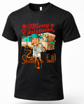 Black Shirt Mockup: Black unisex Christmas graphic t-shirt featuring a funny Shitter's Full camper design, red Merry Christmas lettering, and festive holiday decorations.