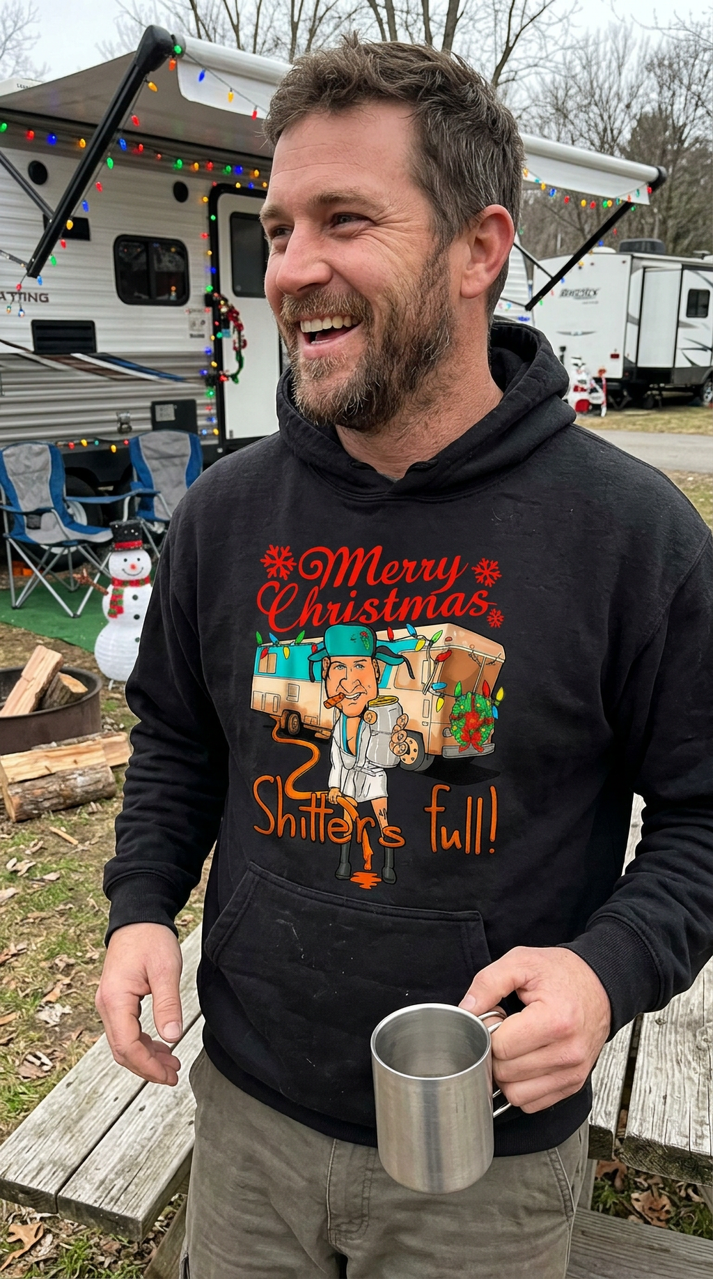 Man wearing black Shitter’s Full Cousin Eddie Christmas Vacation hoodie outdoors with an RV