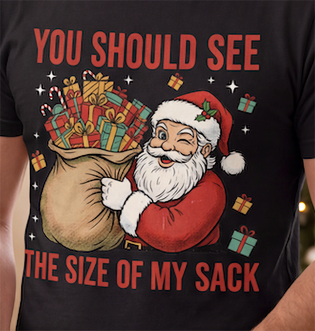 Close-up of funny Santa Size of My Sack Christmas graphic printed on a black shirt.