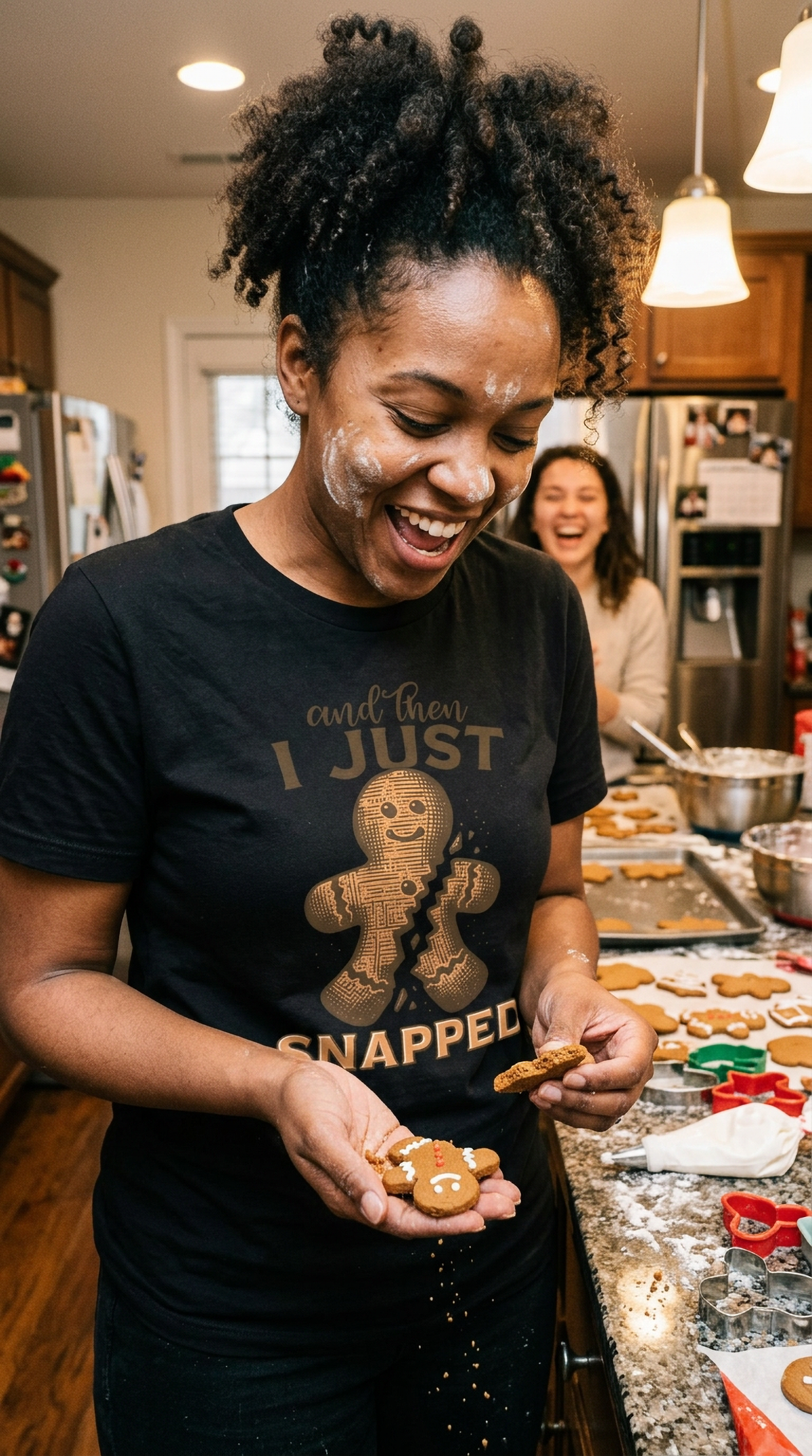 Black Lifestyle: Man wearing a black funny gingerbread Christmas graphic tee while preparing food in a kitchen.