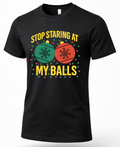 Black unisex Christmas graphic t-shirt featuring colorful ornaments and Stop Staring at My Balls holiday saying.