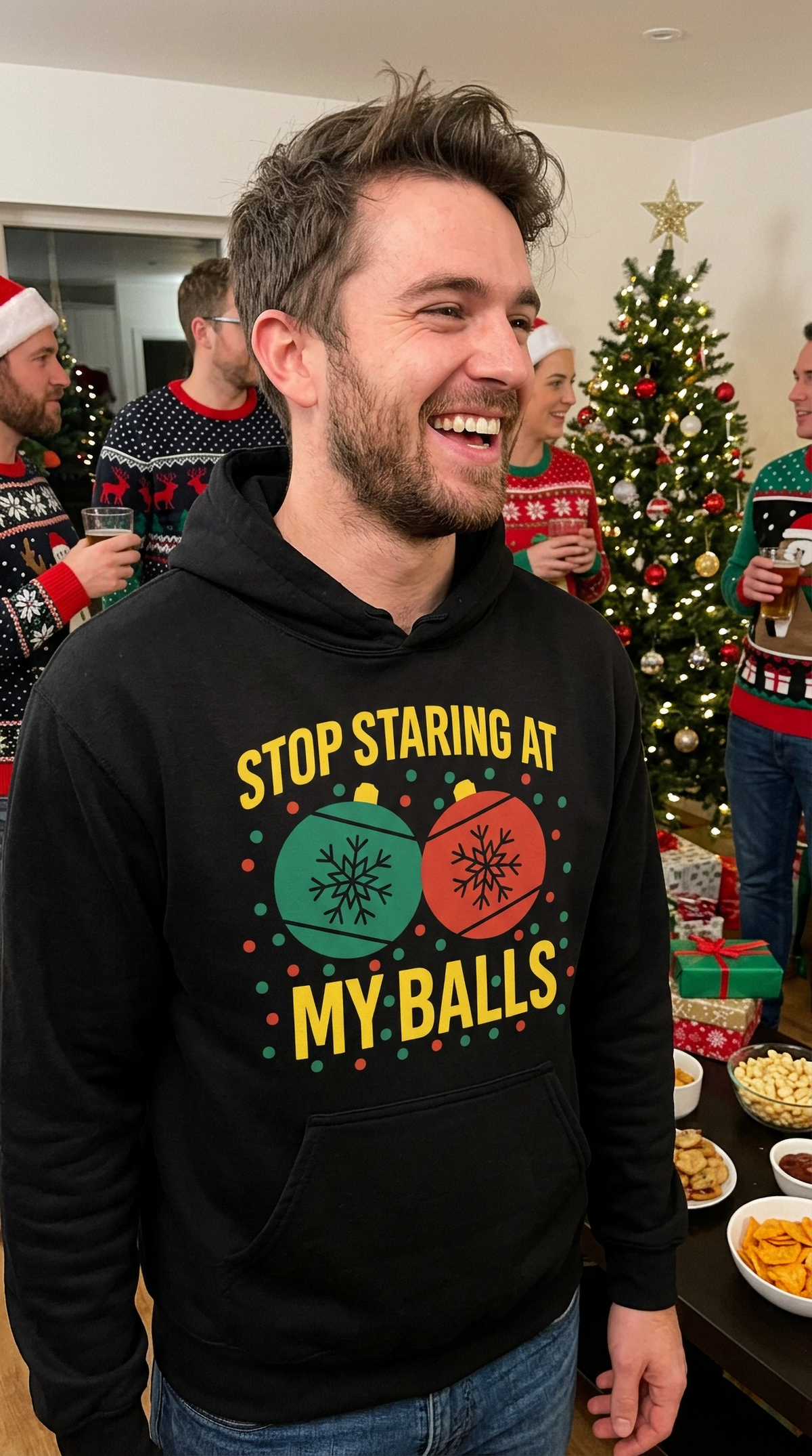 Man wearing black Stop Staring at My Balls funny Christmas hoodie at a holiday party