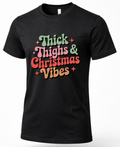 Black Thick Thighs & Christmas Vibes Christmas graphic tee with colorful retro lettering.