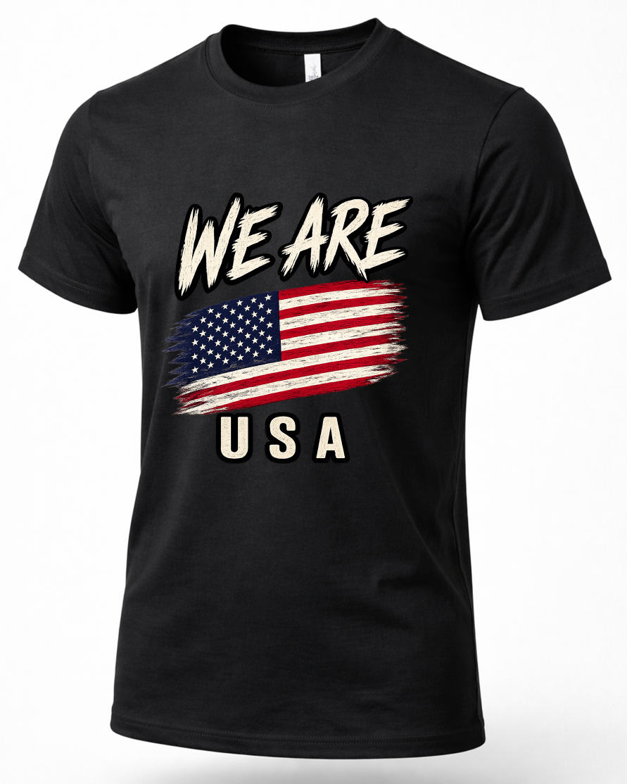 A black short-sleeve crewneck t-shirt featuring a distressed graphic print of the American flag with the text 'WE ARE' above and 'USA' below in a cream-colored stencil font.