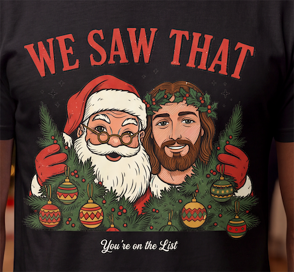 Close-up of We Saw That Santa and Jesus Christmas graphic on black shirt