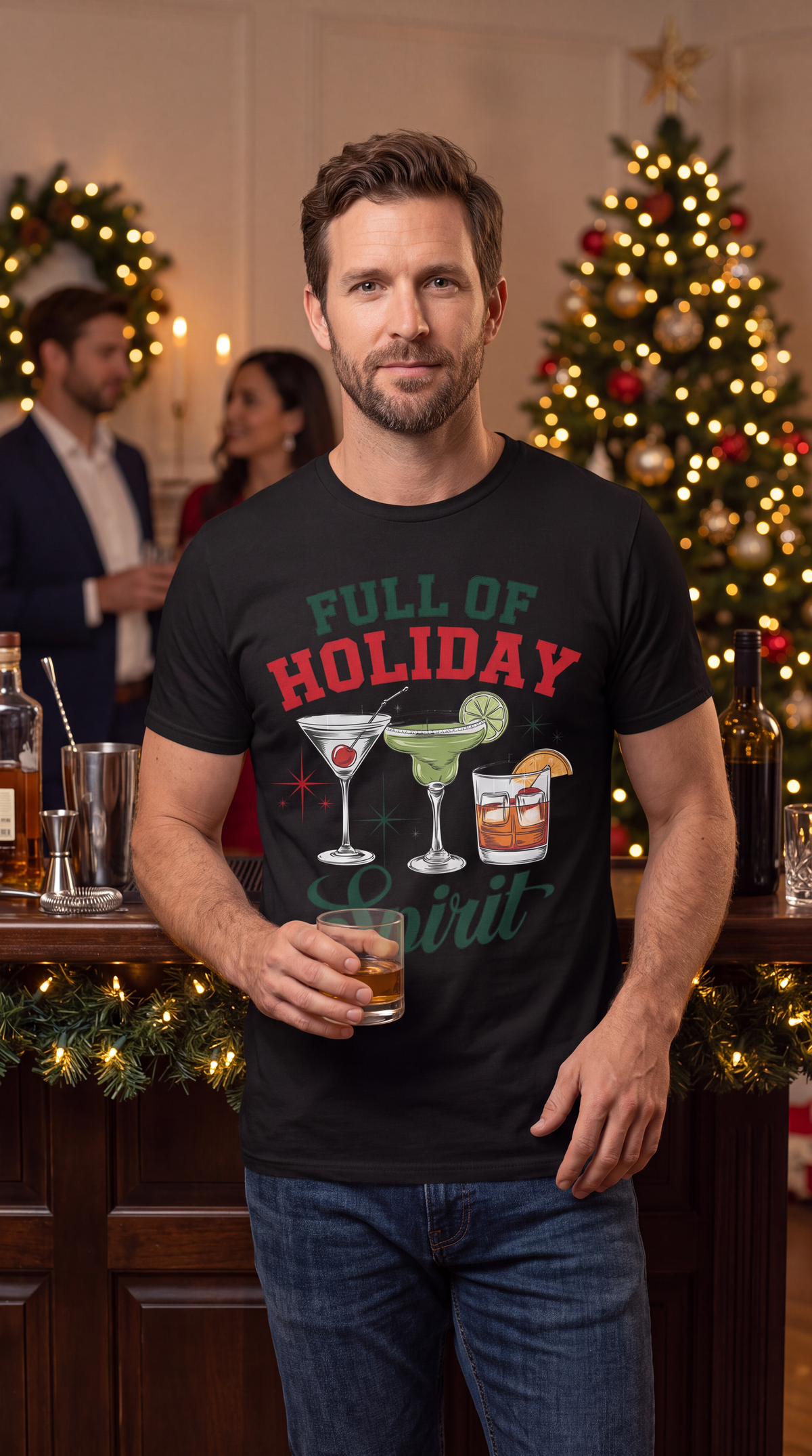 Man wearing black Full of Holiday Spirit Christmas cocktail shirt near a decorated Christmas tree.