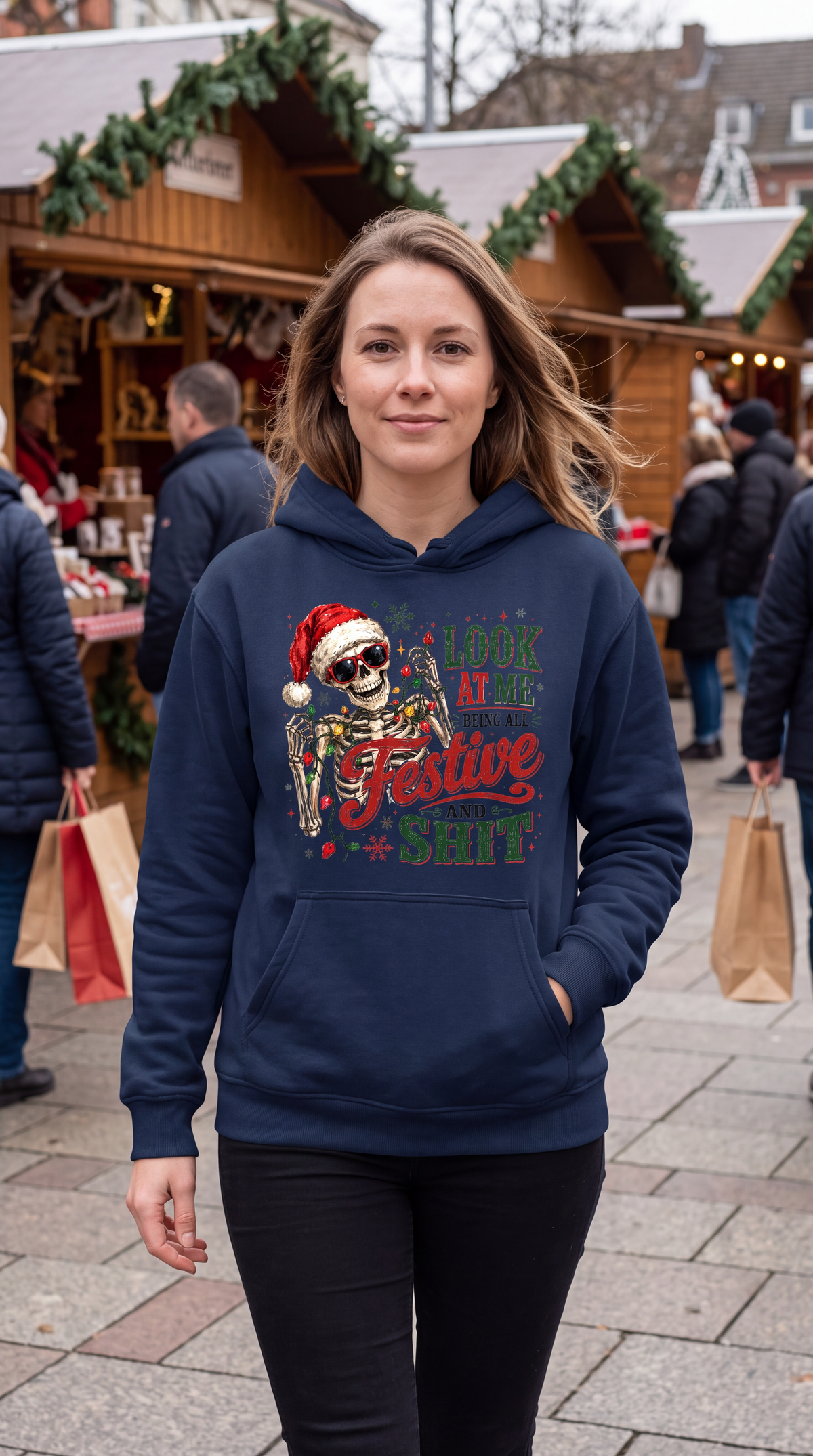Woman wearing navy blue Christmas skeleton hoodie with sarcastic holiday design