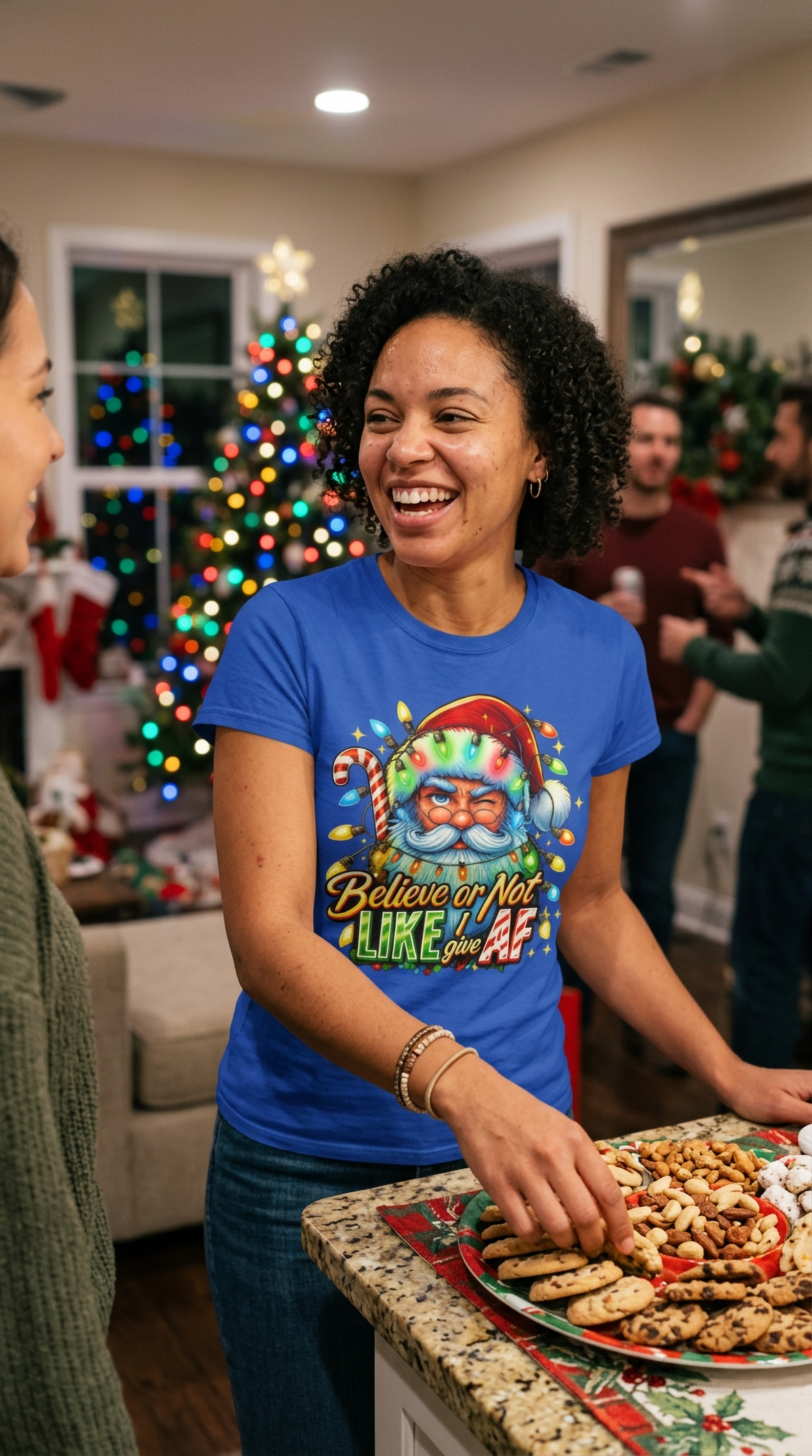 Lifestyle – Blue: Woman wearing a blue Believe or Not sarcastic Santa Christmas t-shirt at a festive indoor holiday gathering.